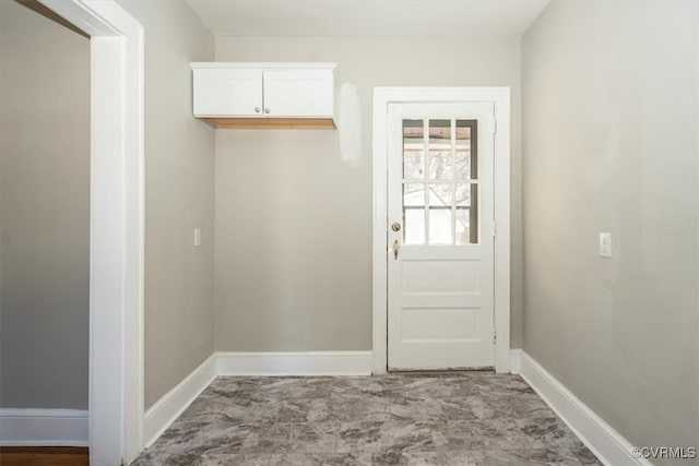 interior space featuring baseboards