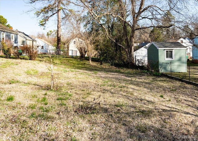 view of yard with a residential view and fence