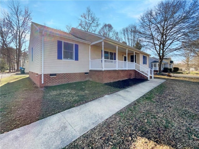 single story home featuring covered porch and crawl space