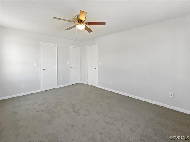 unfurnished bedroom with carpet flooring, ceiling fan, and baseboards