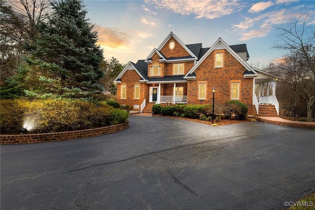 view of front of house with brick siding and driveway