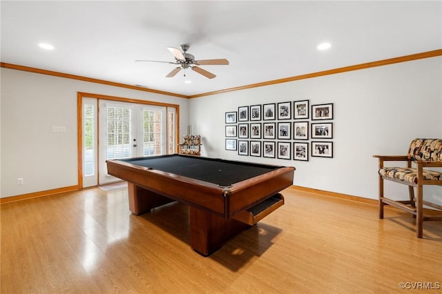 playroom with baseboards, light wood finished floors, pool table, french doors, and crown molding