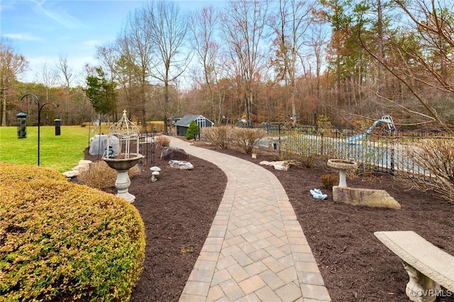 view of yard with an outdoor structure and fence