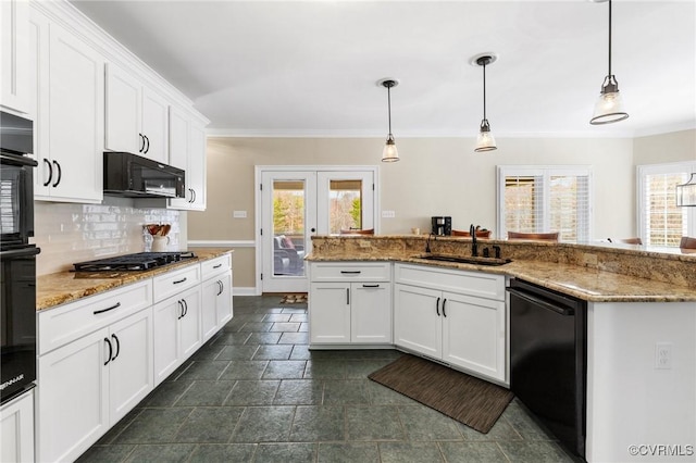 kitchen featuring backsplash, ornamental molding, french doors, black appliances, and a sink