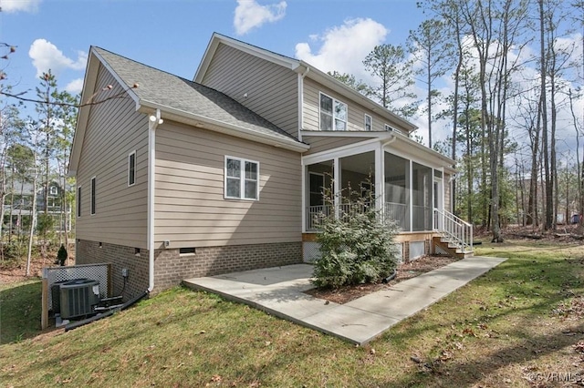 back of property featuring crawl space, a yard, central AC, and a sunroom