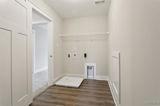 clothes washing area with visible vents, baseboards, laundry area, hookup for a washing machine, and dark wood-style floors