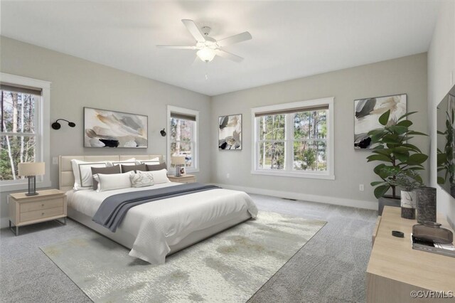 bedroom with carpet flooring, a ceiling fan, and baseboards