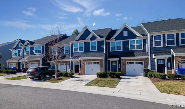 view of property with an attached garage, brick siding, a residential view, and driveway