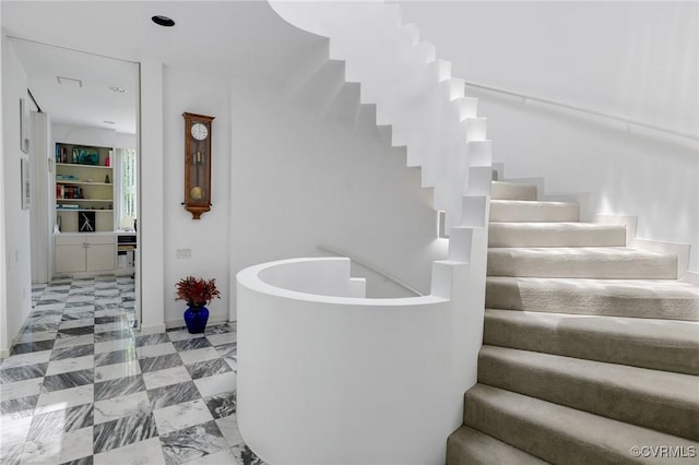 stairway featuring tile patterned floors