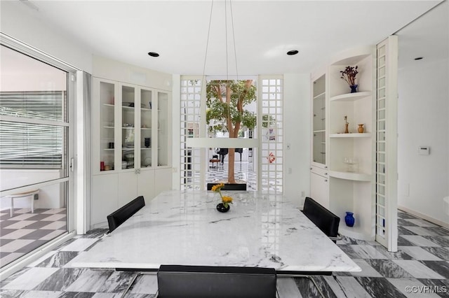 dining area with french doors and built in shelves