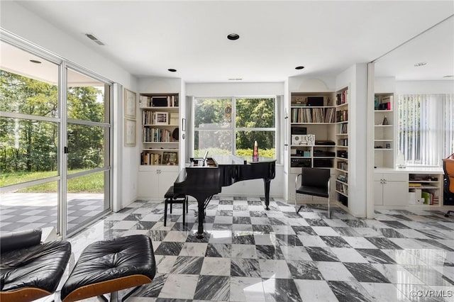 sitting room with a healthy amount of sunlight