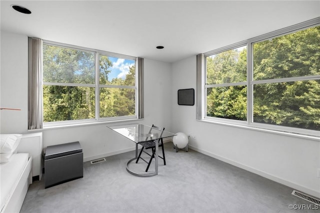 sitting room featuring carpet flooring, baseboards, and visible vents