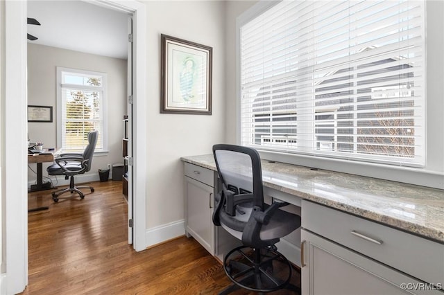 office area with baseboards and wood finished floors