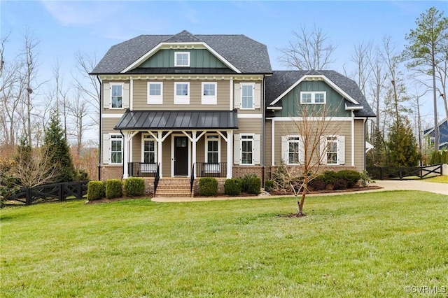 craftsman house with a porch, board and batten siding, and a front yard