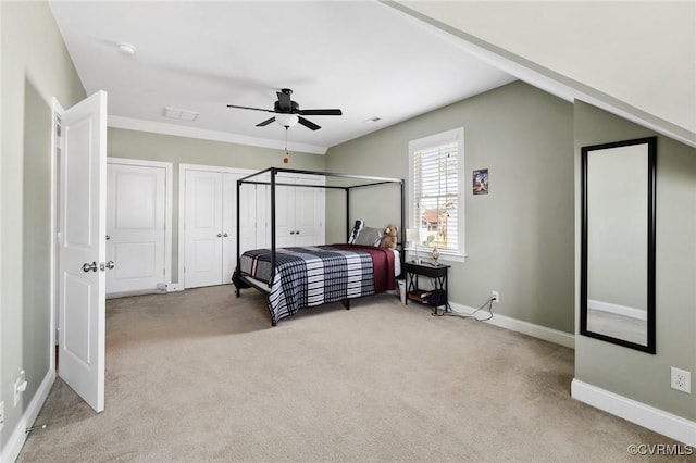 bedroom with visible vents, baseboards, a ceiling fan, and carpet flooring