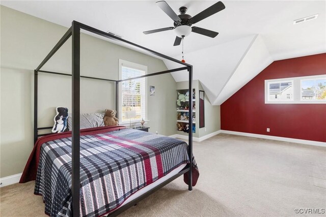 carpeted bedroom with vaulted ceiling, baseboards, visible vents, and ceiling fan