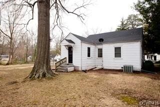 back of property featuring cooling unit and entry steps