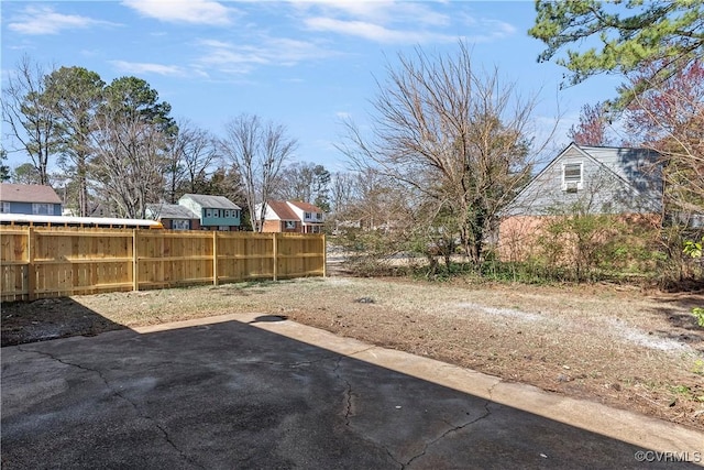 view of yard featuring a patio and fence