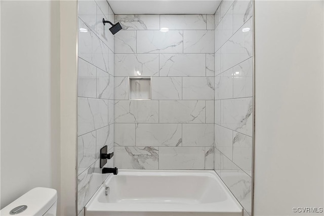 bathroom with toilet and shower / bath combination