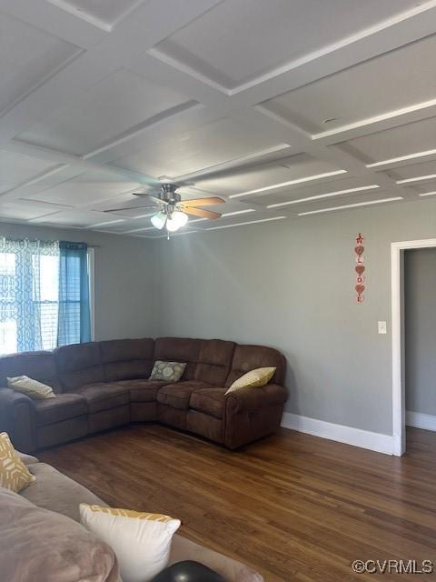 living area with a ceiling fan, wood finished floors, baseboards, and coffered ceiling