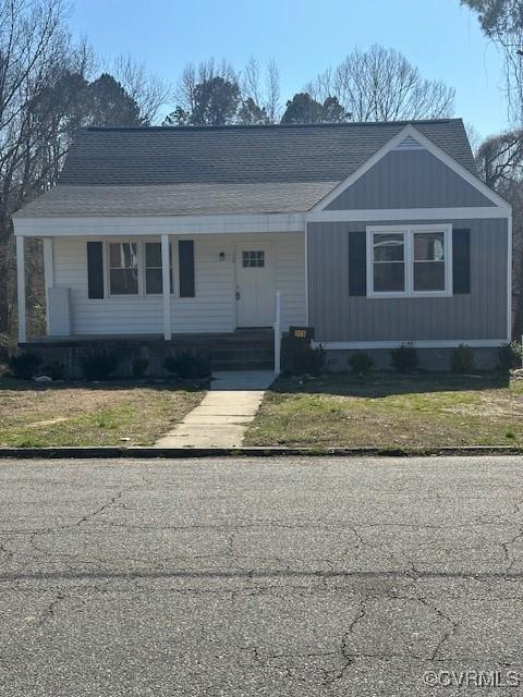 309 W End Blvd, Emporia, VA 23847 - ranch-style home featuring a porch, a shingled roof, and a front yard