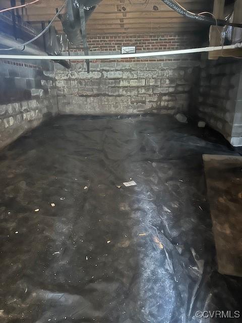 basement with concrete block wall