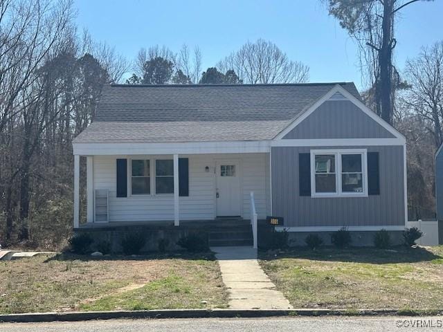 309 W End Blvd, Emporia, VA 23847 - ranch-style home with roof with shingles, covered porch, and a front yard