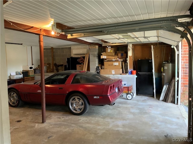 garage with water heater, concrete block wall, and freestanding refrigerator