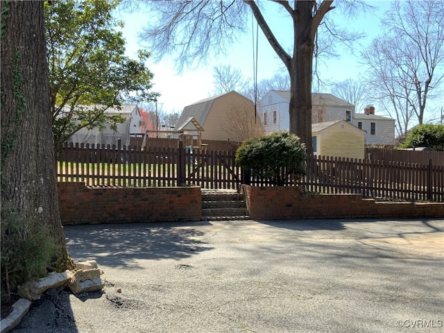 view of gate with fence