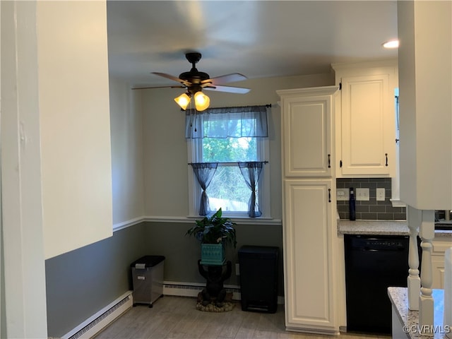 kitchen with decorative backsplash, dishwasher, light countertops, and a baseboard radiator