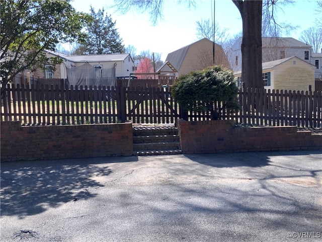 view of gate featuring fence