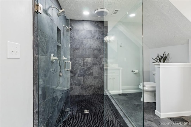 full bath featuring baseboards, a shower stall, vaulted ceiling, a textured ceiling, and toilet