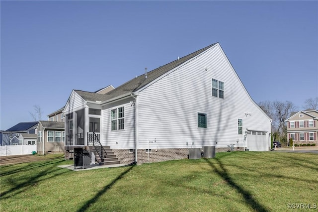 view of property exterior with a yard, cooling unit, and a sunroom