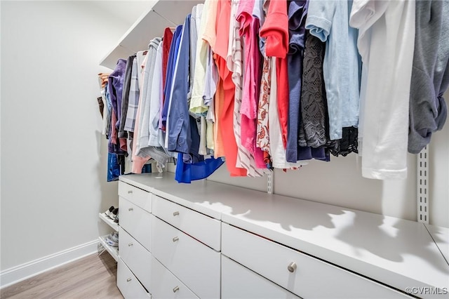 spacious closet with light wood-style flooring