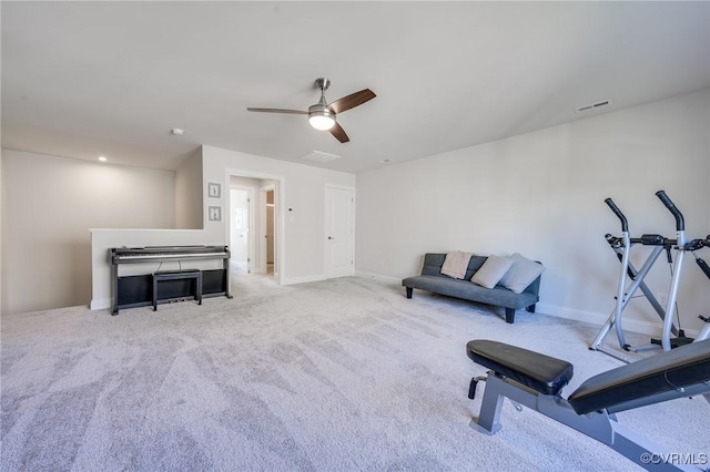 workout room with a ceiling fan, carpet flooring, baseboards, and visible vents