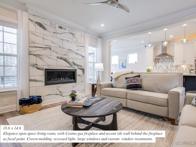 living area featuring baseboards, light wood finished floors, visible vents, a high end fireplace, and ornamental molding