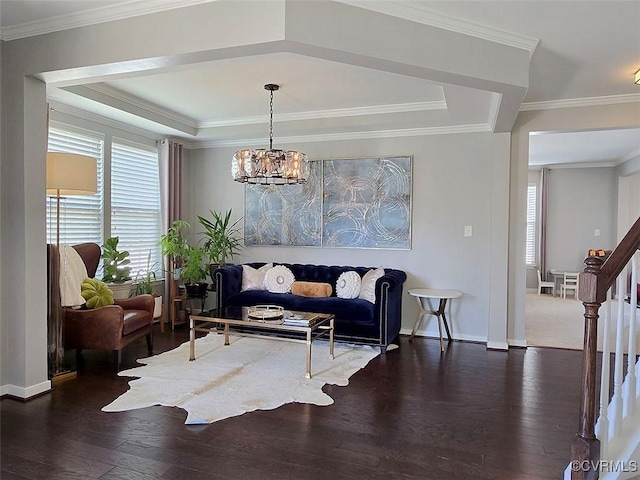 living room featuring a chandelier, stairway, wood finished floors, and ornamental molding