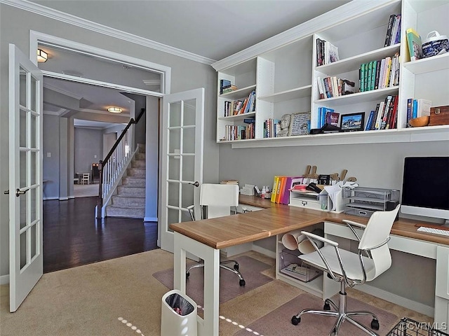 carpeted office with french doors and ornamental molding