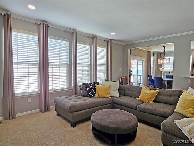 living room featuring baseboards, ornamental molding, light carpet, recessed lighting, and a notable chandelier