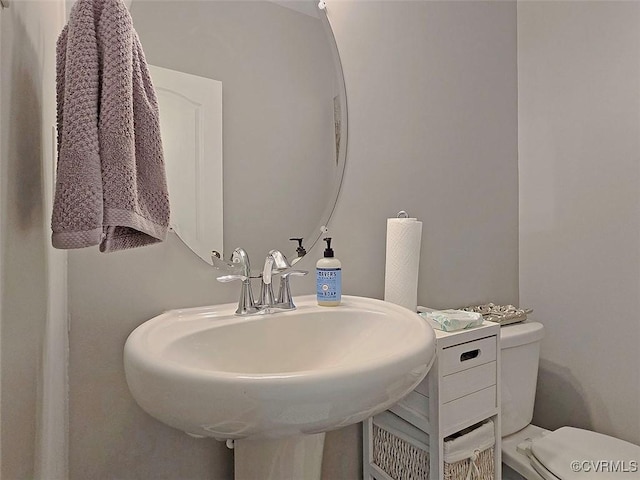 bathroom featuring a sink and toilet