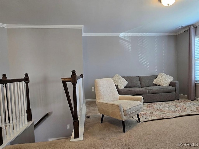 carpeted living room featuring baseboards and ornamental molding