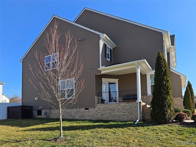 view of side of property with a yard