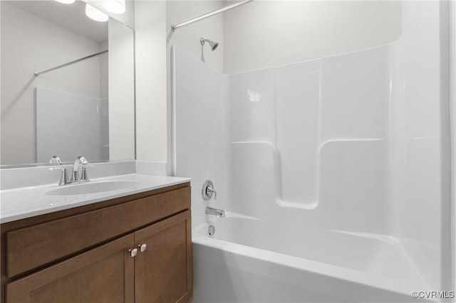 bathroom with bathtub / shower combination and vanity