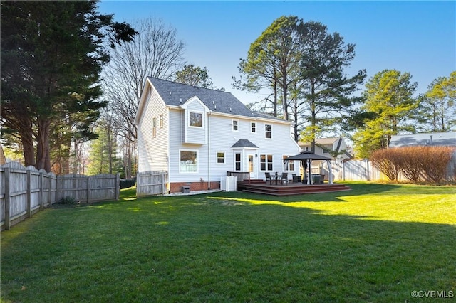 rear view of house with a deck, a fenced backyard, a gazebo, a yard, and crawl space