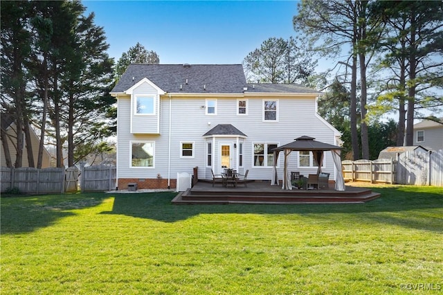 back of property with crawl space, a wooden deck, a fenced backyard, and a yard