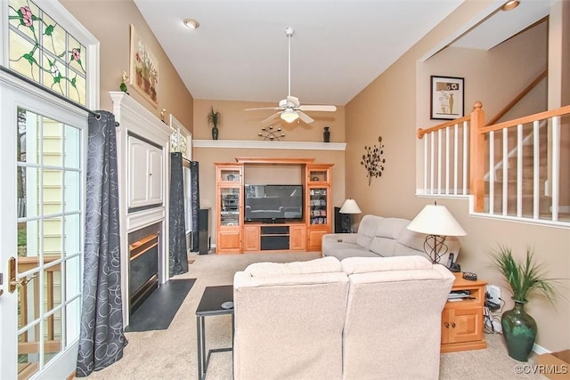 living room with carpet flooring and ceiling fan