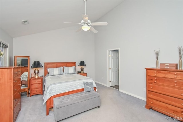 bedroom with visible vents, high vaulted ceiling, baseboards, light colored carpet, and ceiling fan