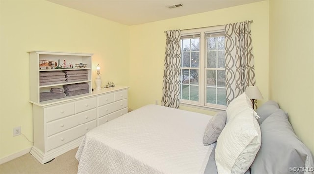 bedroom featuring visible vents, carpet floors, and baseboards