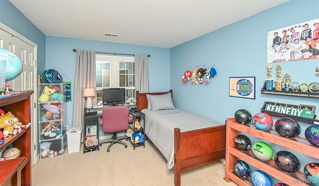 bedroom with carpet flooring and visible vents