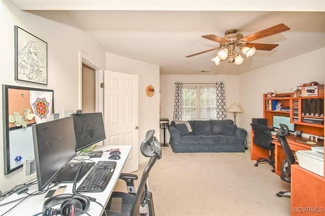 carpeted office featuring ceiling fan